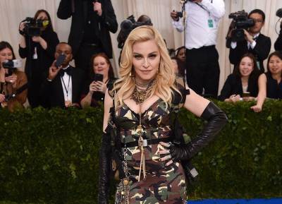 Madonna bares all as she poses topless in bucket hat and crutch - evoke.ie