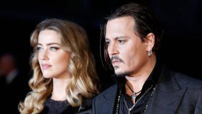 Johnny Depp Takes Stand in U.K. Libel Trial, Claims Amber Heard Hit Him - www.hollywoodreporter.com - Britain