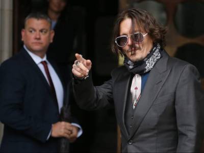 Johnny Depp denies slapping ex-wife in row over 'Wino forever' tattoo - canoe.com - Britain