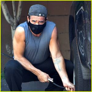 Colin Farrell's Muscles Are on Display While Adding Air to His Tires - www.justjared.com