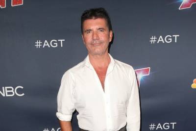 Simon Cowell hospitalized after ‘breaking his back’ during bike accident - www.hollywood.com - California