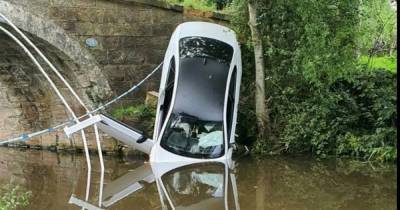 Brand new £50,000 BMW plunges into canal after M6 pursuit - www.manchestereveningnews.co.uk