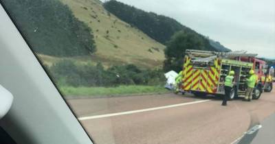 Emergency services race to horror crash on M90 as car and caravan ‘plunge down embankment’ - www.dailyrecord.co.uk - Scotland