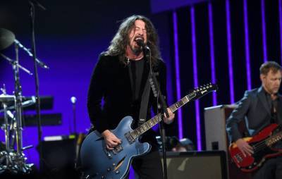 Watch Dave Grohl surprise fan as he joins ‘Grohlathon’ and plays drums - www.nme.com