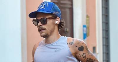 Harry Styles Sports ’70s-Inspired Quarantine Mustache While Jogging in Rome - www.usmagazine.com - Italy - Rome
