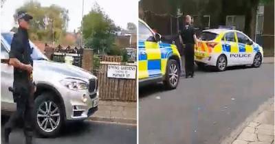 Huge 'armed' police response after 'knife-wielding man threatens people in street' - www.manchestereveningnews.co.uk