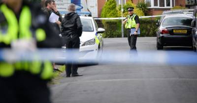 Man in his 30s left seriously injured after attack as police shut road off - www.manchestereveningnews.co.uk - Manchester