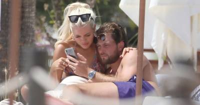 Lewis Burton and Lottie Tomlinson cosy up on sun lounger during romantic Ibiza holiday - www.ok.co.uk