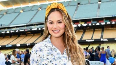 Chrissy Teigen Bares Her Growing Baby Bump and Shares Nightstand Pregnancy Cravings - www.etonline.com
