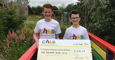 Singing stars Alfie and Jack present £500 cheque to CHAS' Robin House hospice - www.dailyrecord.co.uk - Scotland