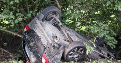Air ambulance scrambled after car hits tree and flips onto its roof - www.manchestereveningnews.co.uk - county Lane