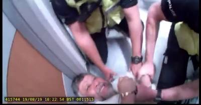 Doctor dragged away from daughter's death bed by police in harrowing footage - www.dailyrecord.co.uk