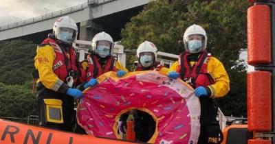 Teens adrift in pink inflatable doughnut rescued out at sea by helicopter - www.dailyrecord.co.uk