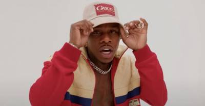 DaBaby flexes at a photoshoot for the “PEEPHOLE” music video - www.thefader.com