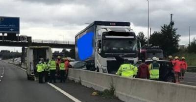 A car got crushed between a lorry and the central reservation on the M62 - incredibly no-one was seriously injured - www.manchestereveningnews.co.uk