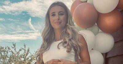 Pregnant Dani Dyer is every inch the glowing mum-to-be as she shows off bump in bodycon white dress - www.ok.co.uk