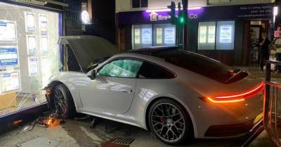 Man arrested after Porsche ploughs into estate agents in late night smash - www.manchestereveningnews.co.uk