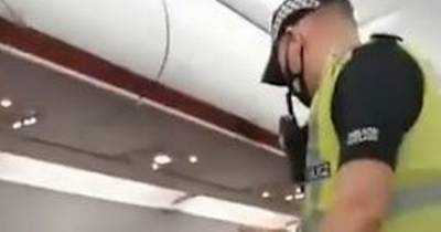 EasyJet passenger filmed being removed from flight by police for refusing to wear face masks - www.manchestereveningnews.co.uk - London