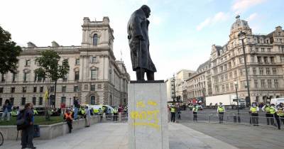 Winston Churchill statue vandalised as 'racist' scrawled on monument by climate change activists - www.dailyrecord.co.uk