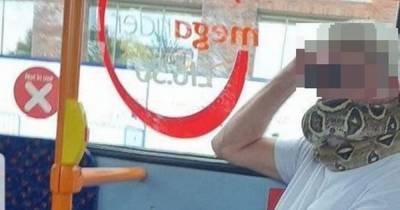 Man using A SNAKE 'as face covering' seen riding bus in Greater Manchester - www.manchestereveningnews.co.uk - Manchester