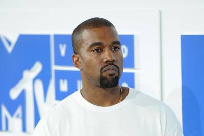 Kanye West urinates on Grammy Award as he fights for record label release - www.hollywood.com