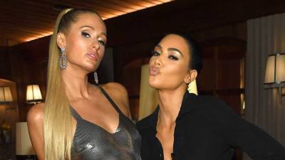 Kim Kardashian and Paris Hilton Pose Together as 'Opposite Twins' - www.etonline.com