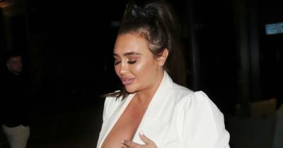 Lauren Goodger puts on eye-popping display in very plunging white suit as she celebrates 34th birthday - www.ok.co.uk - London
