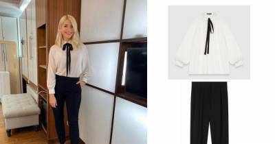 Holly Willoughby shows off incredible figure in white pussy-bow blouse and black trousers on This Morning - get the look here - www.ok.co.uk