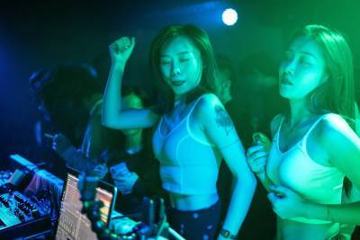 Photos show Wuhan clubbers partying maskless in former COVID-19 epicenter - nypost.com - China - city Wuhan