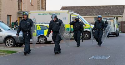 Cops armed with riot shields swoop on Moray street as man arrested - www.dailyrecord.co.uk - Scotland