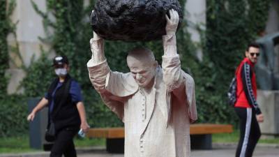 Sculpture of John Paul II with rock, red water makes waves - abcnews.go.com - Italy - Poland - city Warsaw, Poland