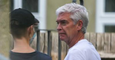 Phillip Schofield seen inspecting damage done to his neighbour's car outside new £2 million bachelor pad - www.ok.co.uk