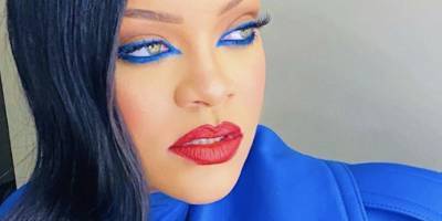 Rihanna Looks Positively Regal in Royal Blue Eyeliner and a Matching Trench Coat - www.harpersbazaar.com