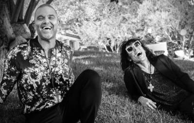 Listen to The Struts team up with Robbie Williams on new ballad ‘Strange Days’ - www.nme.com