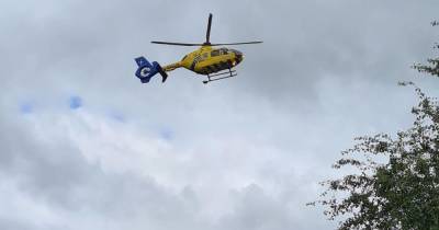 Major road shut with air ambulance called after car and bus crash - the Vauxhall driver fled - www.manchestereveningnews.co.uk