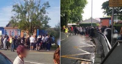 The photos of parents at school gates sparking concern over social distancing - just hours after children went back to school - www.manchestereveningnews.co.uk - Manchester