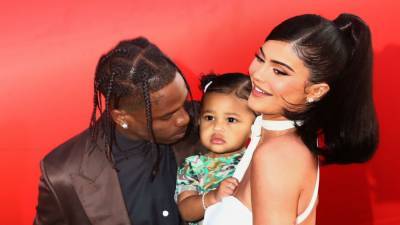 Watch Travis Scott and Kylie Jenner Try to Get 2-Year-Old Stormi to Pose for a Family Photo - www.etonline.com