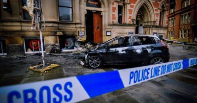 Four in hospital after car smashes into popular Manchester restaurant and bursts into flames during the early hours of New Year's Day - www.manchestereveningnews.co.uk - Manchester