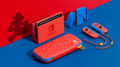 Nintendo unveils Mario themed Switch console, releasing next month - www.nme.com