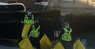 'Cannabis farm' probe in Edinburgh as cops filmed carrying huge evidence bags from property - www.dailyrecord.co.uk - Scotland