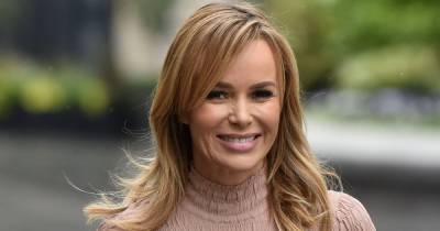 Amanda Holden strikes a sultry pose as she shows off her lavish new kitchen with statement lighting - www.ok.co.uk - Britain