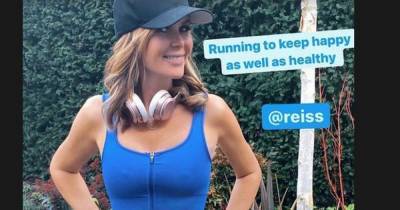Amanda Holden flaunts toned figure as she flashes midriff in tiny blue workout gear while on run - www.ok.co.uk
