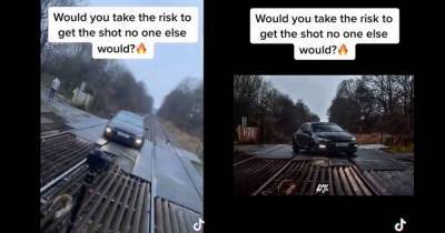 'Stupidity at a staggering level': TikTok video shows car photoshoot on live railway crossing - www.manchestereveningnews.co.uk