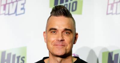 Robbie Williams 'tests positive for coronavirus' while on holiday and is 'quarantining in the Caribbean' - www.ok.co.uk
