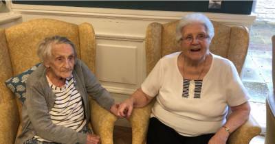 Moment best friends reunited at care home after 73 years become among first in Wigan to receive vaccine - www.manchestereveningnews.co.uk