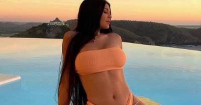 Kylie Jenner sends fans wild as she debuts extra-long hair in bikini snaps – but is slammed for travelling - www.ok.co.uk