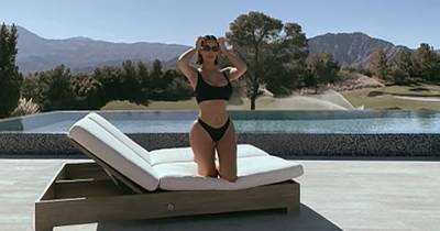 Kim Kardashian Shares a Throwback Bikini Pic Amid Kanye West Divorce Rumors: ‘This Is Paradise’ - www.usmagazine.com