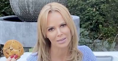 Amanda Holden puts on sexy display as she flaunts her cleavage and eats vegan cookies by her hot tub - www.ok.co.uk - Britain