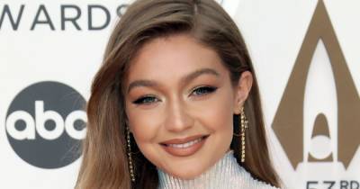 Gigi Hadid Kisses Her and Zayn Malik’s 4-Month-Old Daughter in Rare Selfie: ‘The Best Kid’ - www.usmagazine.com - Los Angeles