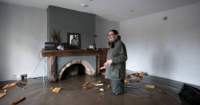 'I sat and just watched the water coming through the back door': Woman describes moment her home flooded after hours of torrential rain - www.manchestereveningnews.co.uk - county Lane